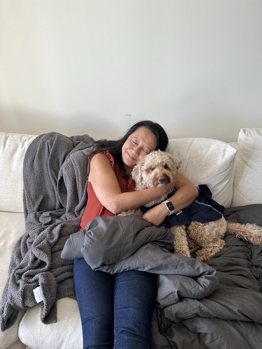 Gigi snuggling Frank on the couch